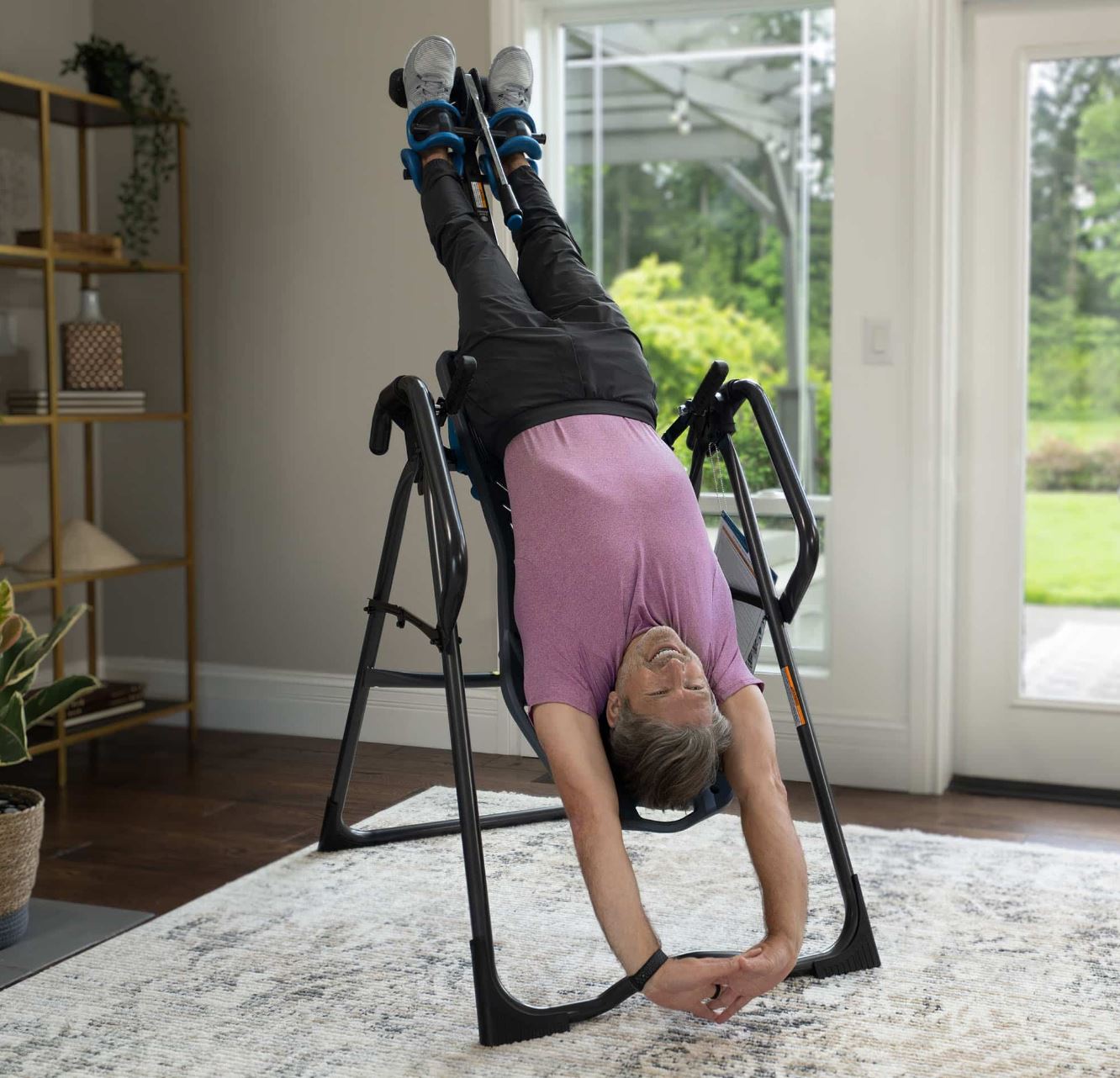 Me hanging upside down using the Teeter FitSpine X3 Inversion Table