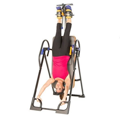 Lady upside down on a excerpeutic 975sl inversion table